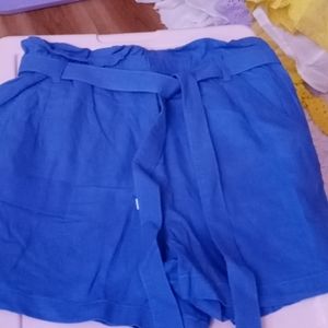 Blue paper bag shorts by Ana.